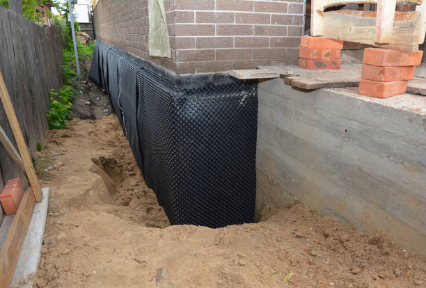 Happy homeowners after waterproofing job in Audubon
